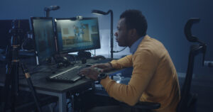 Still Image of Medium Shot Of A Digital Artist Working On An Animated Film In A Common Office