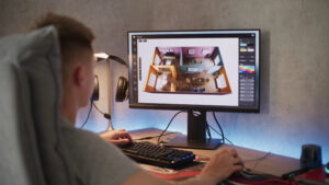 Still Image of Young 3d Designer Creates And Develops Stylish House Interior Using Pc And Professional 3d Modeling Software Or Design App Caucasian